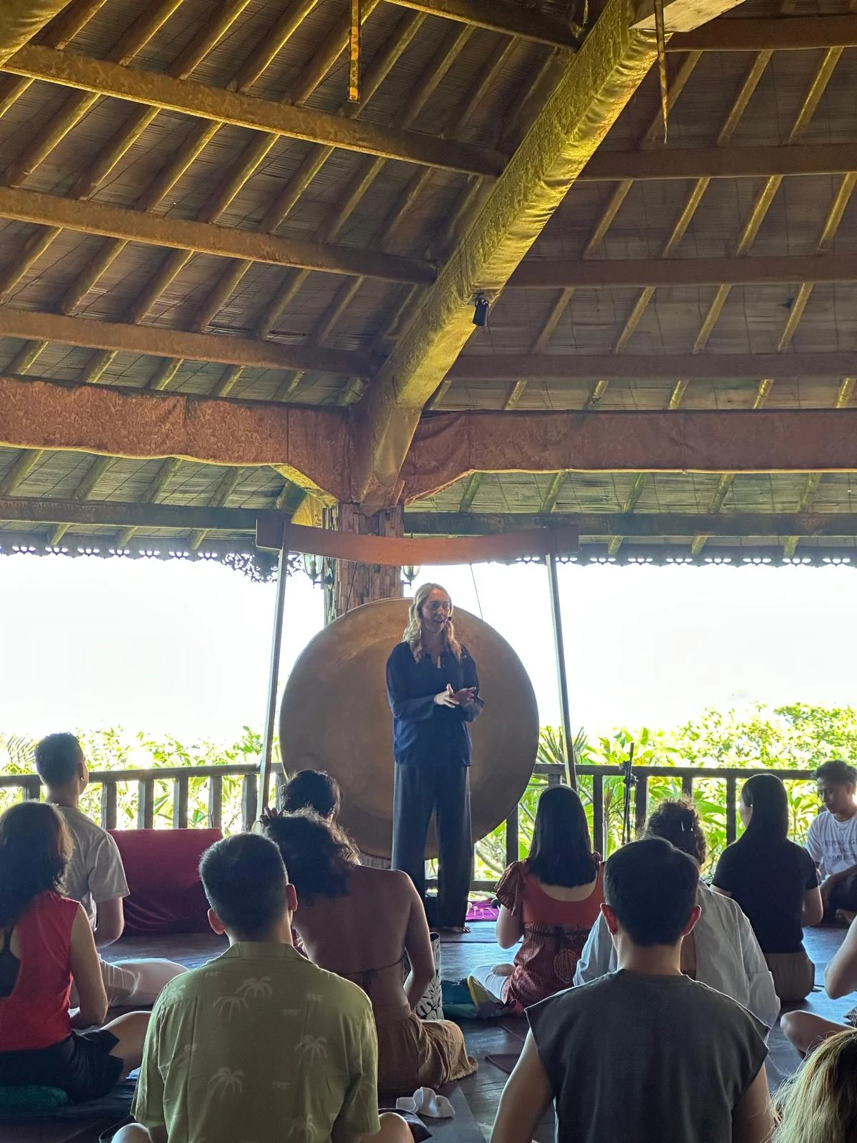 Catherine leading a retreat group in an open-air pavilion